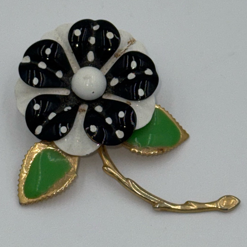 Vintage Black and White Floral Brooch with Gold-Tone Accents